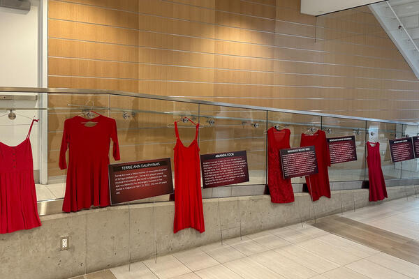 Red dresses hang from the staircase of Health Expansion building to commemorate Red Dress Day