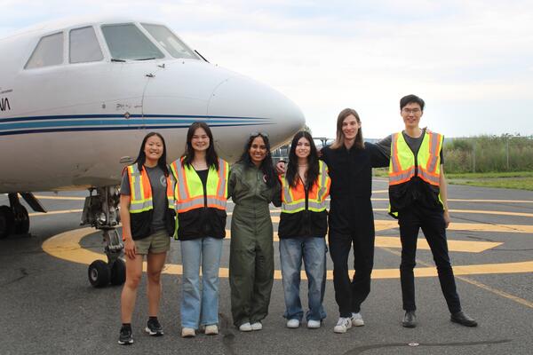 Waterloo Space Soldering Team standing in front of an aircraft