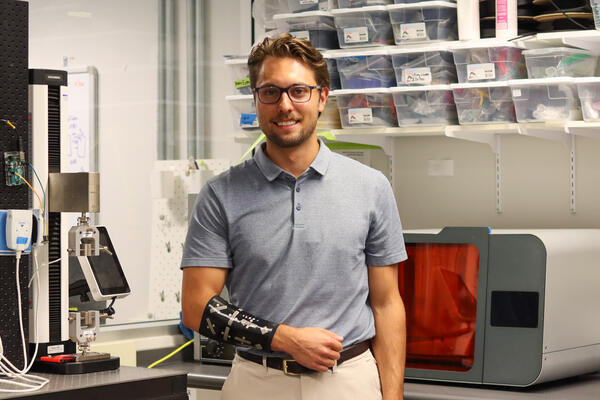 Nicholas Levinski wearing a prototype of the lymphedema sleeve