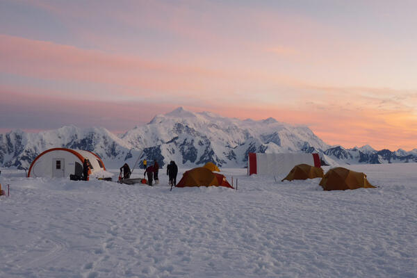 A camp in winter at Kluane National Park at sunset