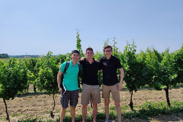Jack Paduchowski and team standing in a vinyard