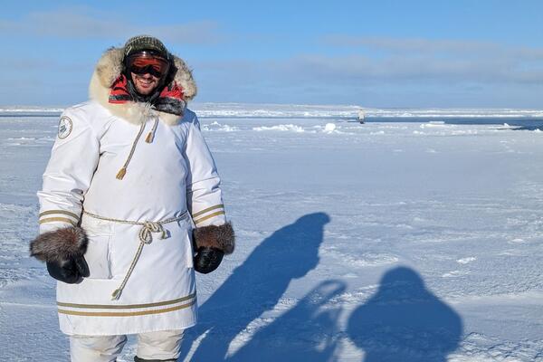 Man standing on ice pack in Nunavut 