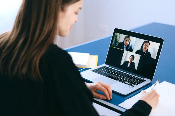 Some on a video call with four other people 