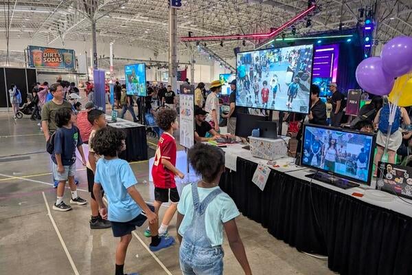Children testing out games at CNE