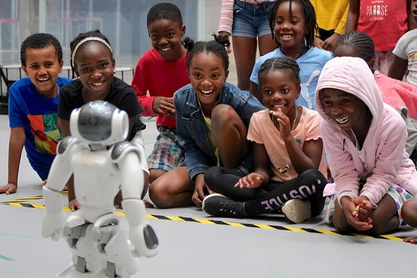 young students and robot