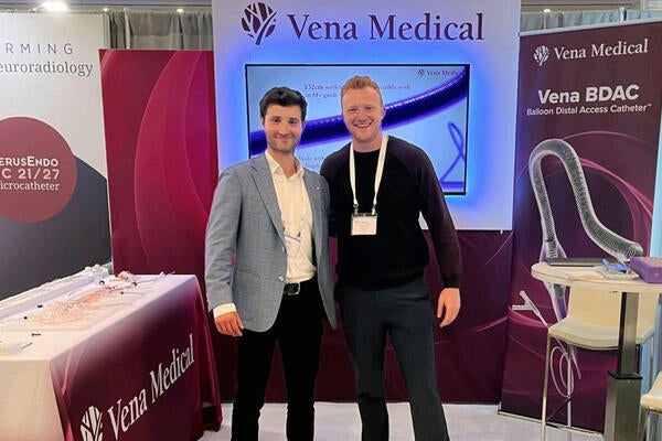 co-founders of Vena pose in front of a Vena Medical sign