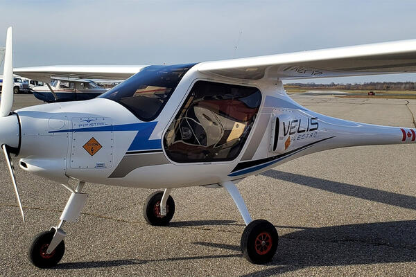 Electric plane parked on ground