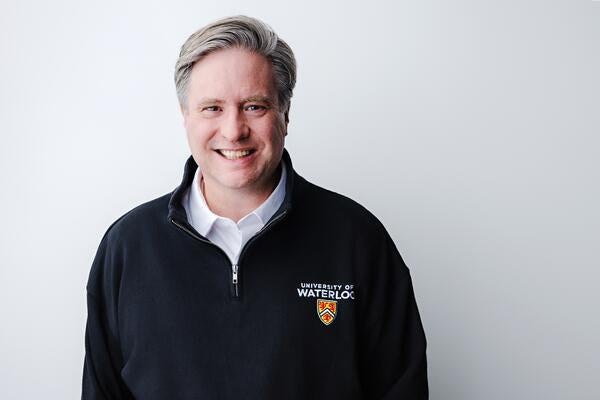 Dr. Bill Rosehart wearing a UWaterloo polo shirt