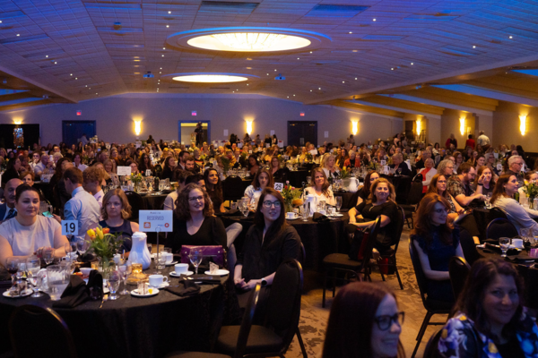 Attendees sitting at tables for the Women of the Year awards