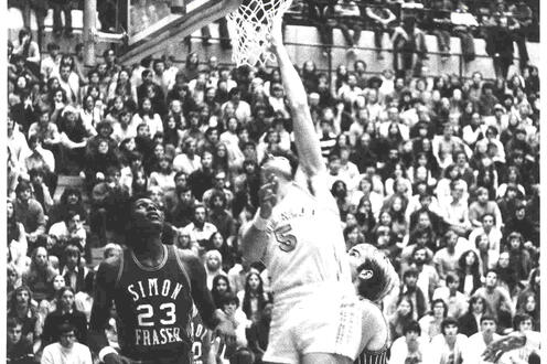 Waterloo Warriors player Jeff Scott tries to make a layup during a basketball game 