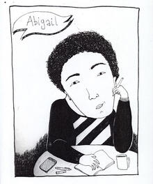 Black and white llustrated cis-gender woman with short, curly black hair sitting at a desk with notebook and pen, and the label Abigail.