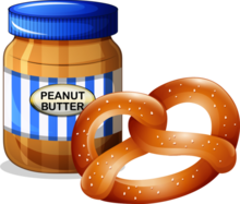 a jar of peanut butter beside a pretze