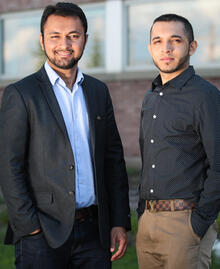 Rumman Rahman (right) and Nirbhay Singh (left) standing in front of a building.