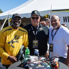Friends smile while watching the game 