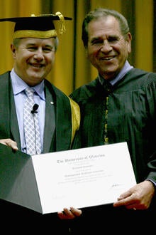 Professor Schuster receiving a distinguished professor award