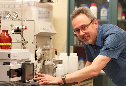 Philippe Van Cappellen in front of lab equipment