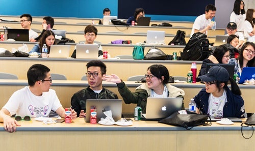 Groups of students working in Hackathon classroom