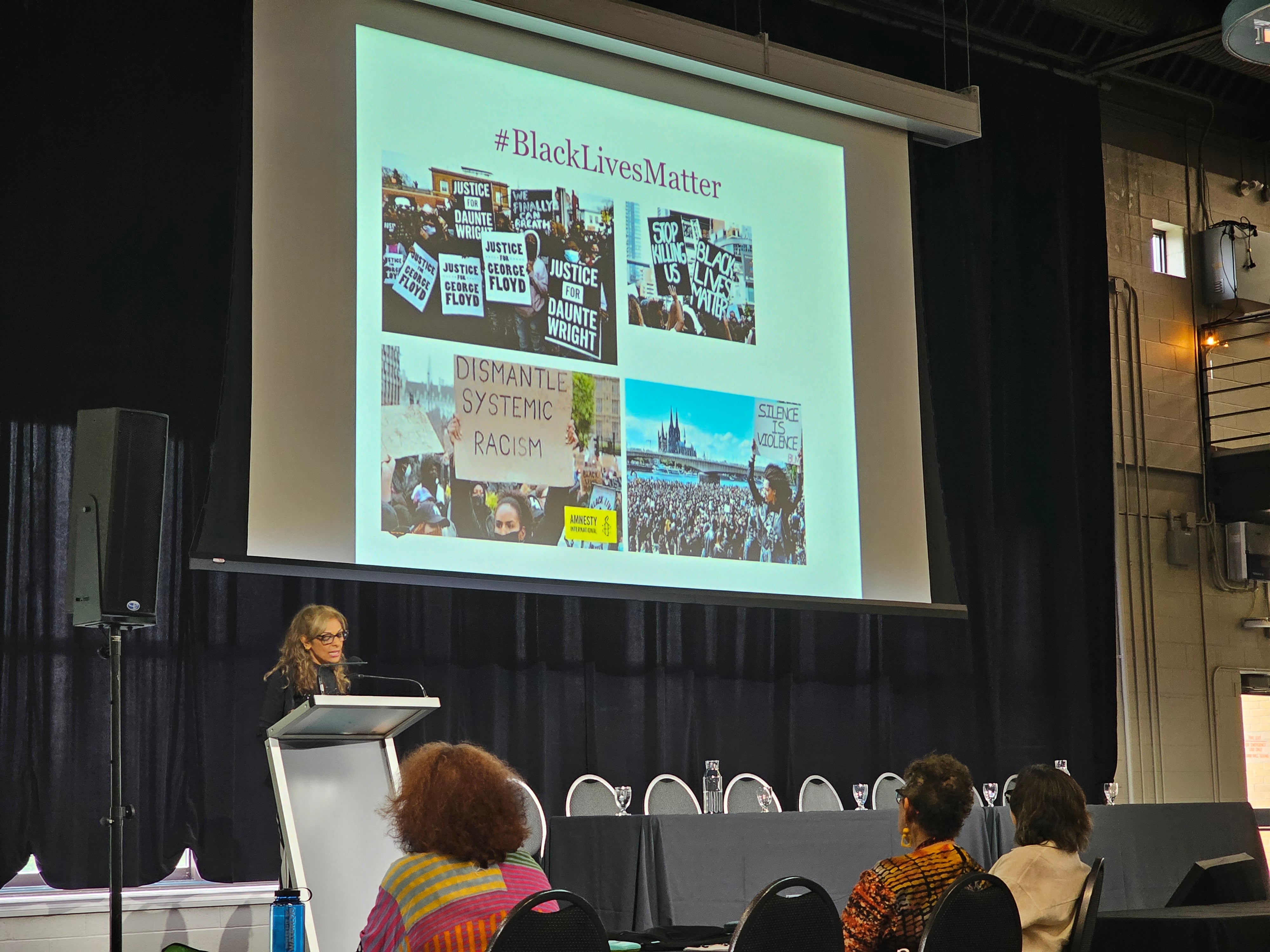 Dr. Kalwant Bhopal standing at podium during her keynote address