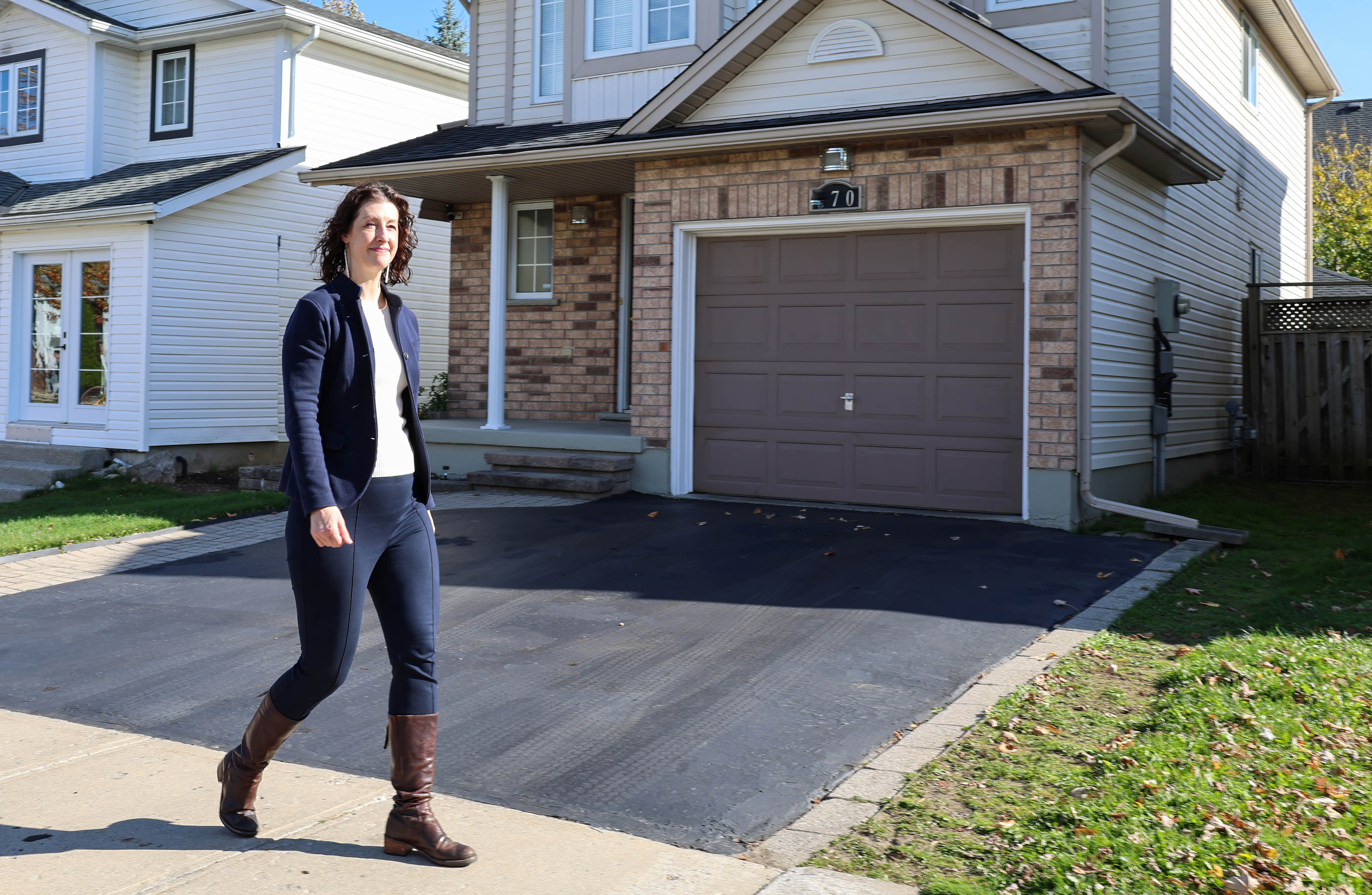 Leia Minaker walks in a residential neighbourhood