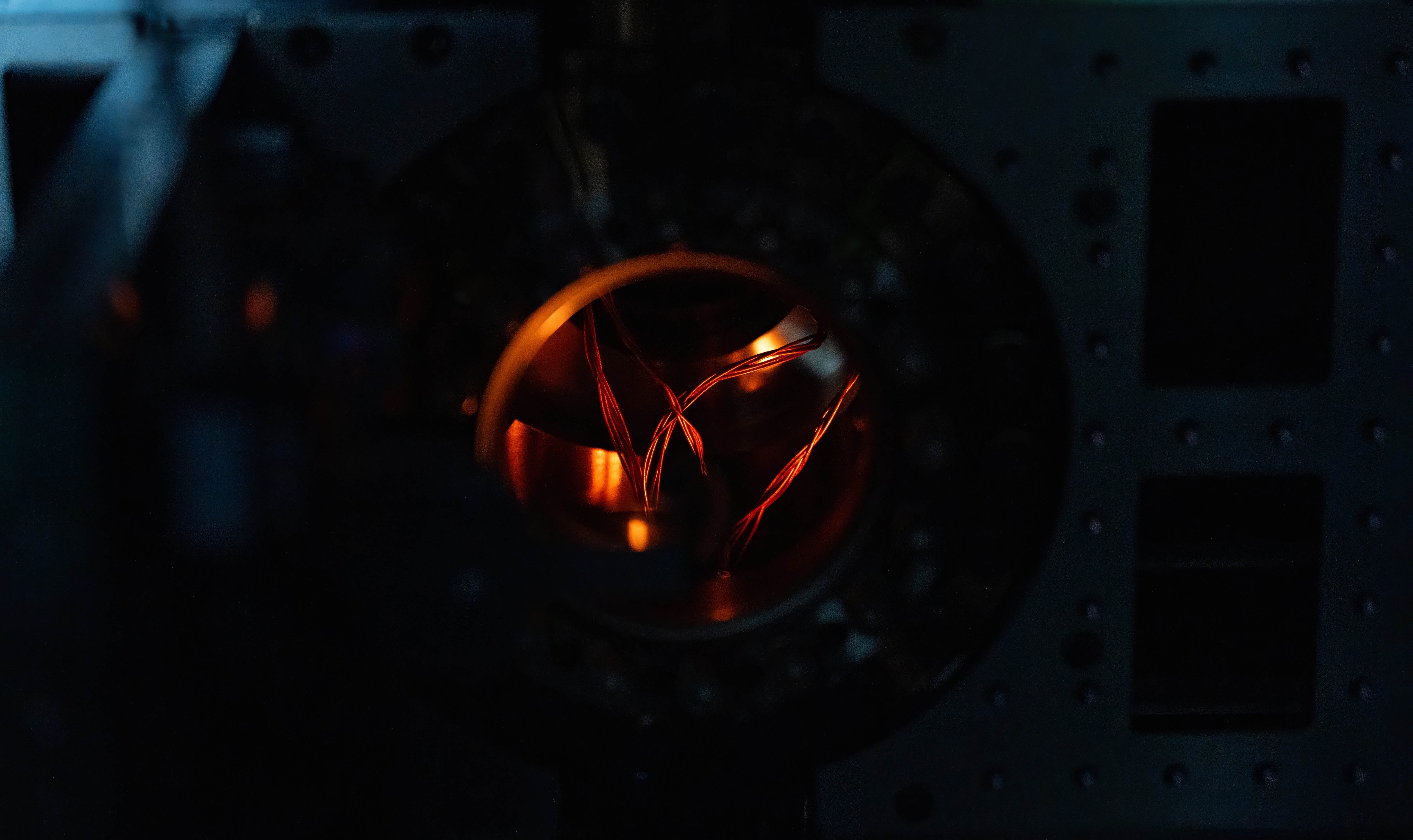 Interior of QND system with wires exposed within circular chamber