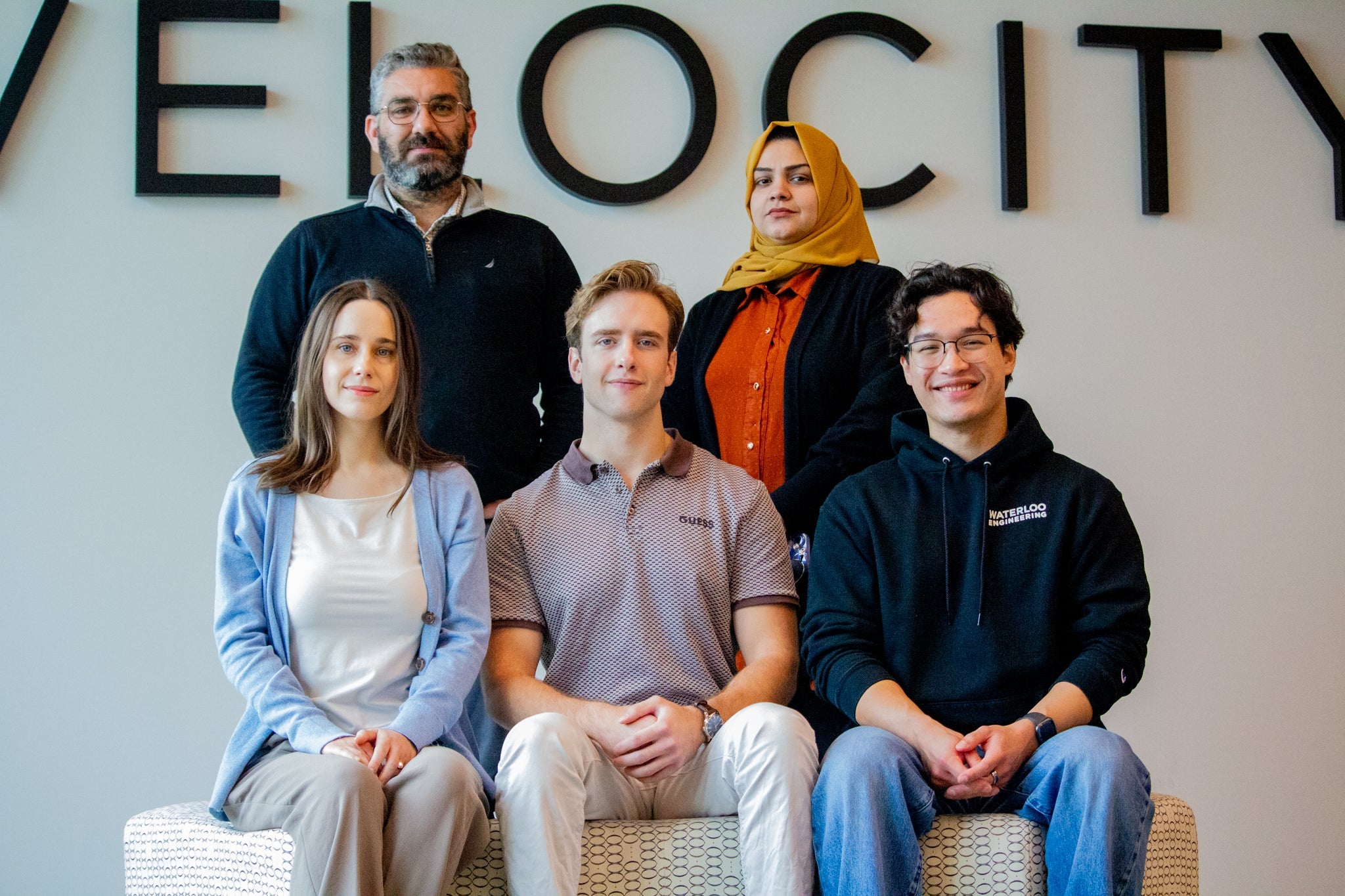 Phantom Photonics team pose in front of Velocity sign