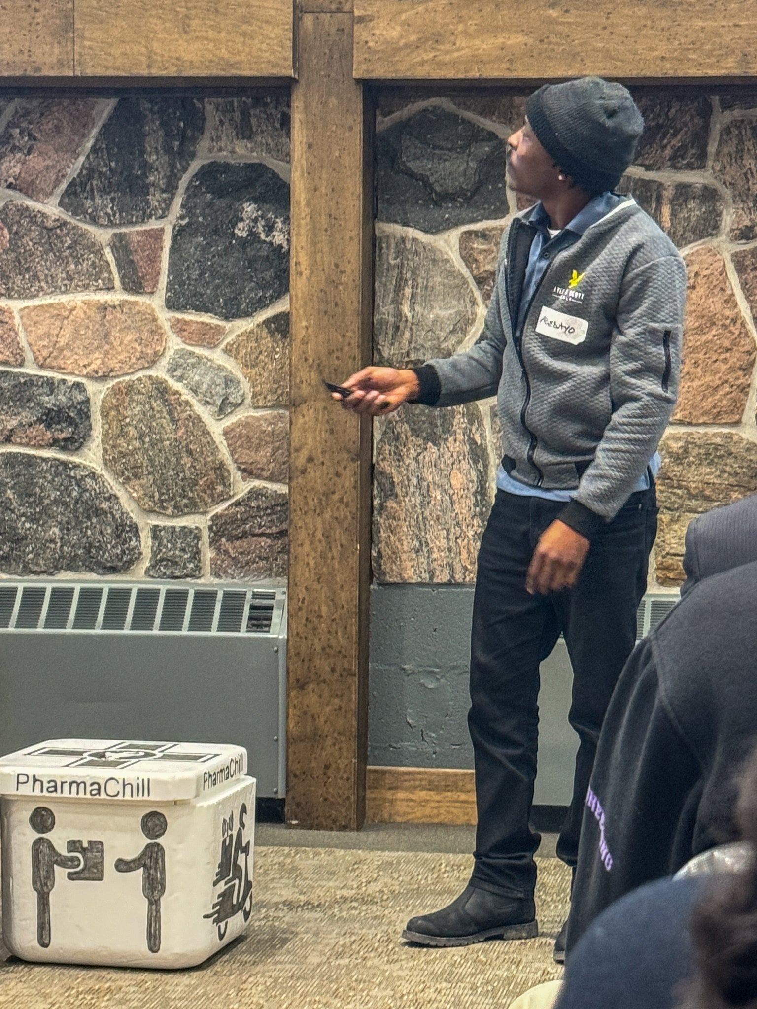 Adedayo Adefarakan showcasing presenting his pitch on PharmaChill with the pharmabox prototype on display
