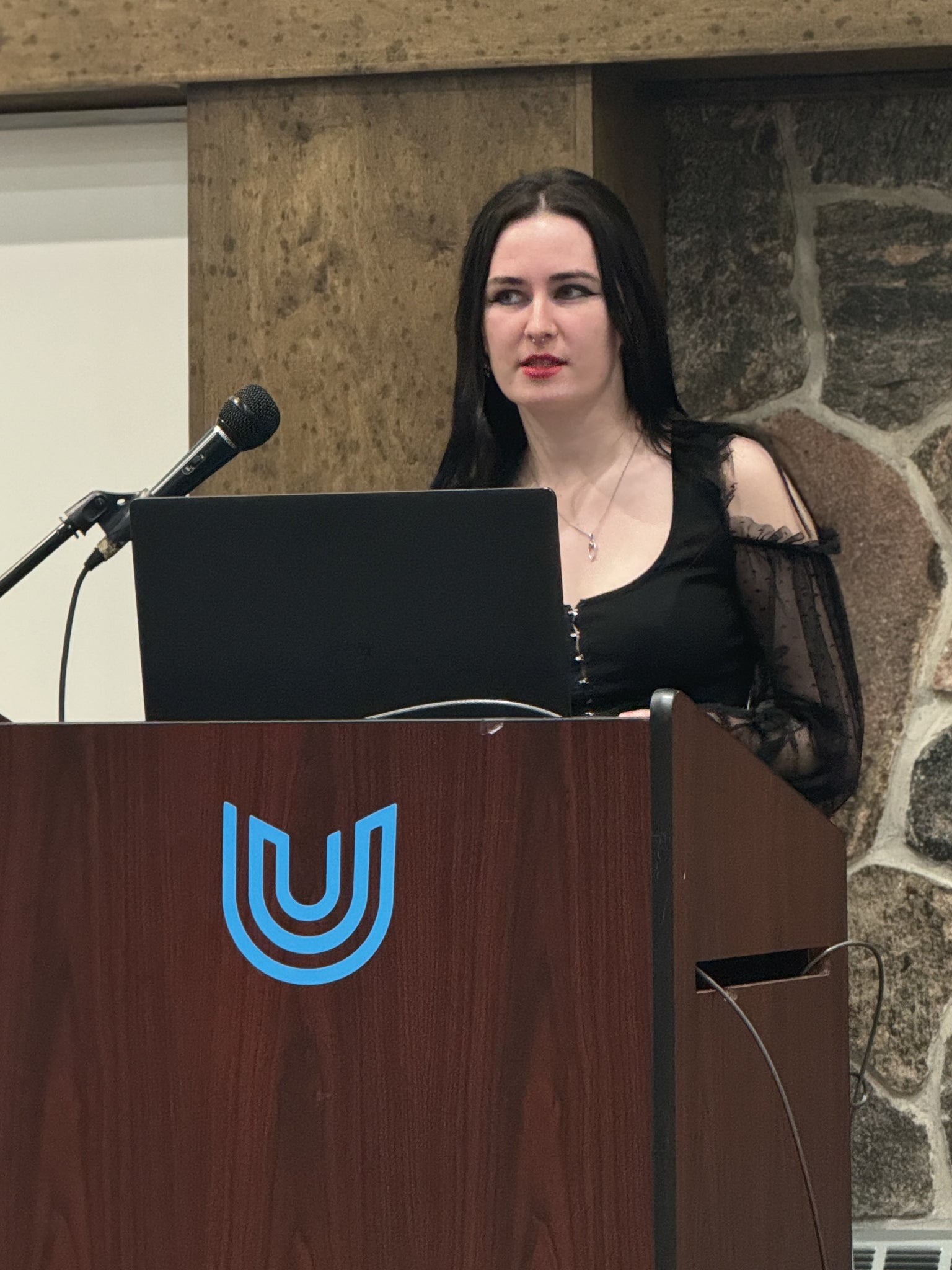 Emma Schuster presenting at the 31st Social Impact Showcase