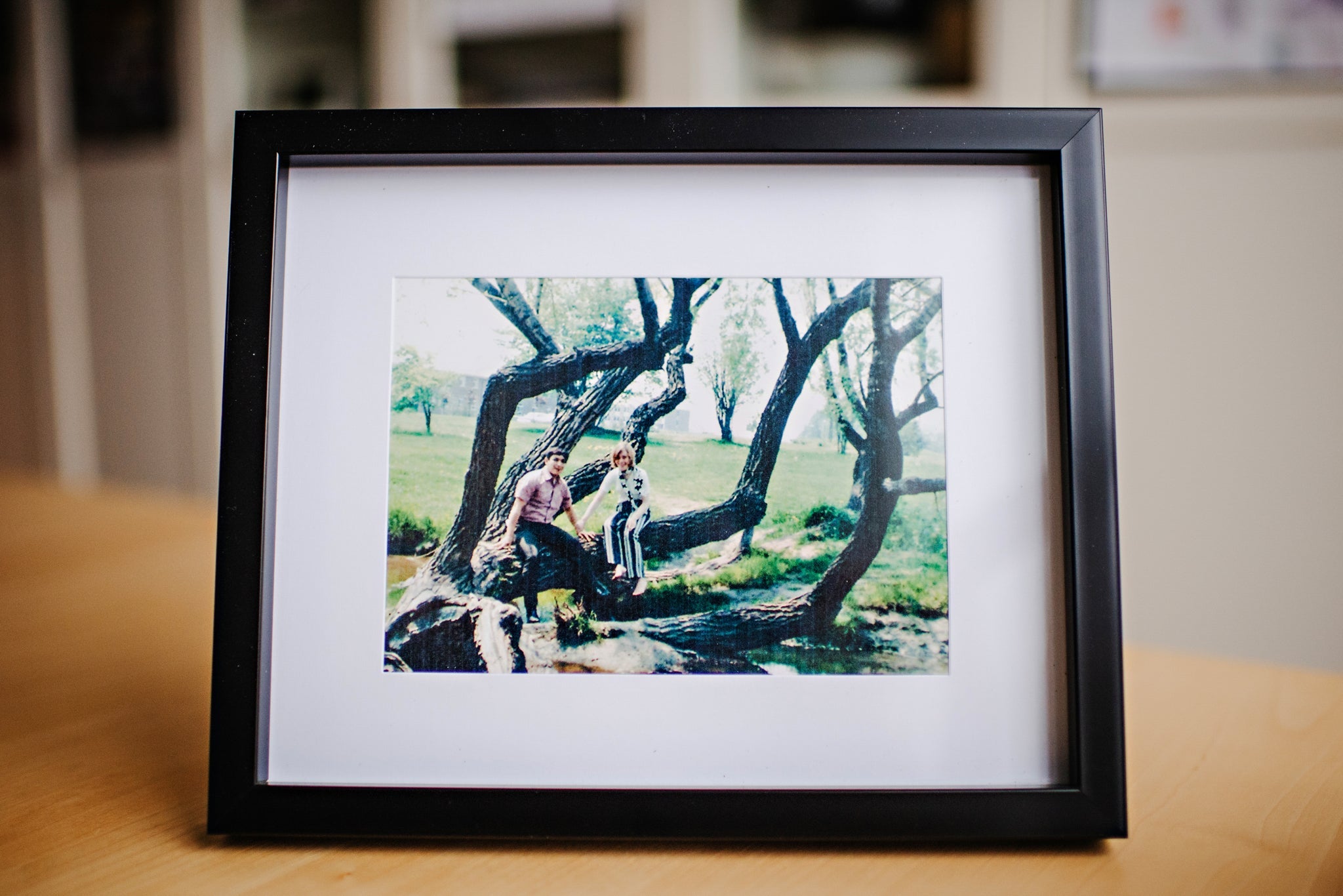 Picture frame holding an image of Gil and his wife when they were younger