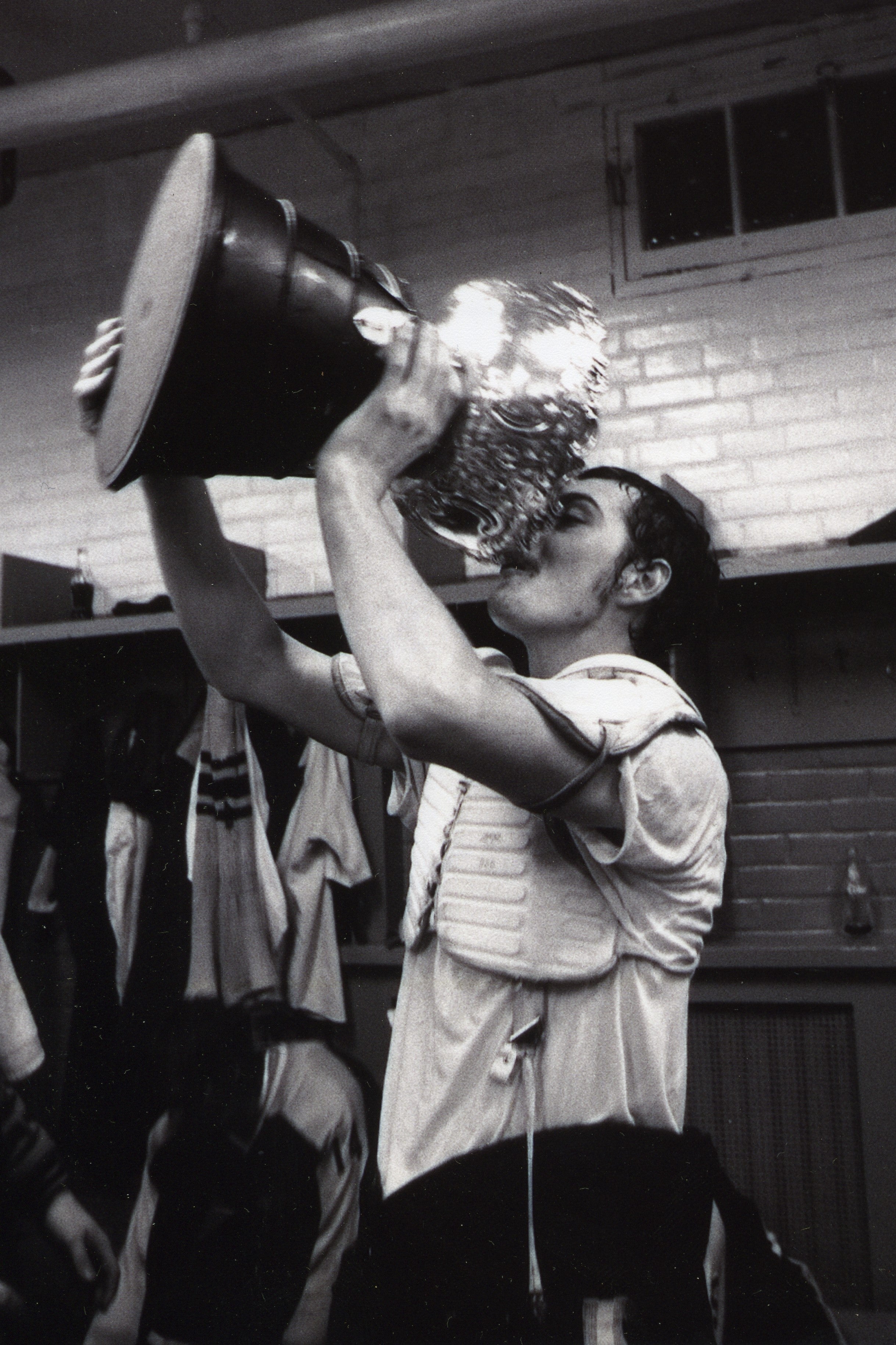 Player drinking from trophy