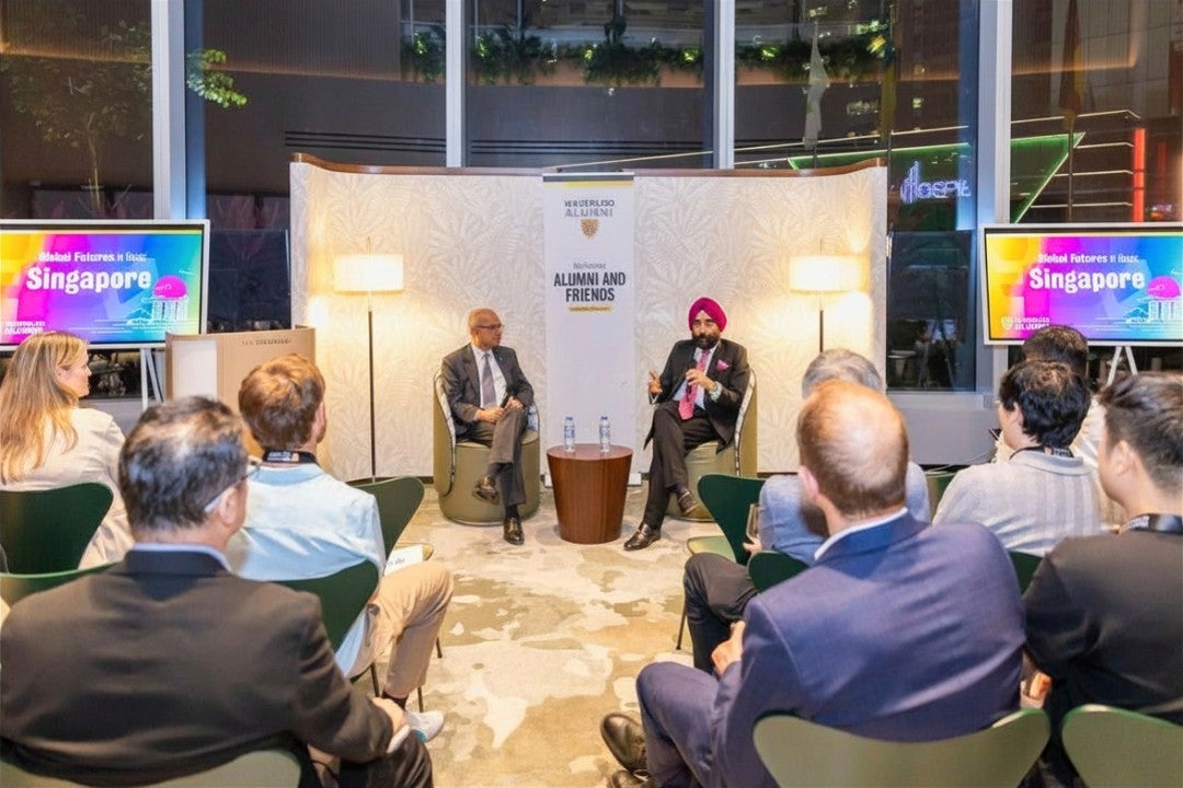Goel and Bachher speaking at the event in Singapore