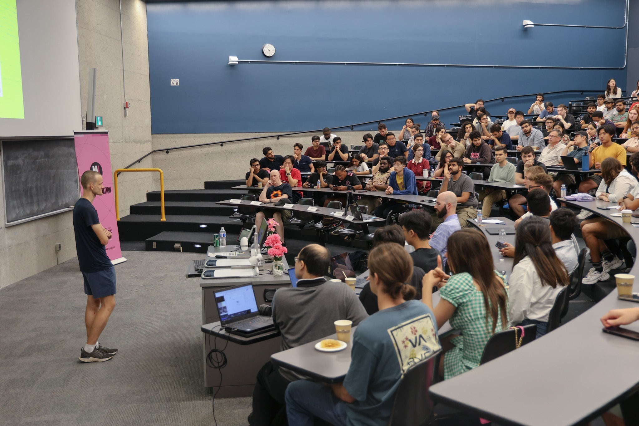 Vitalik Buterin speaks to a full crowd of students