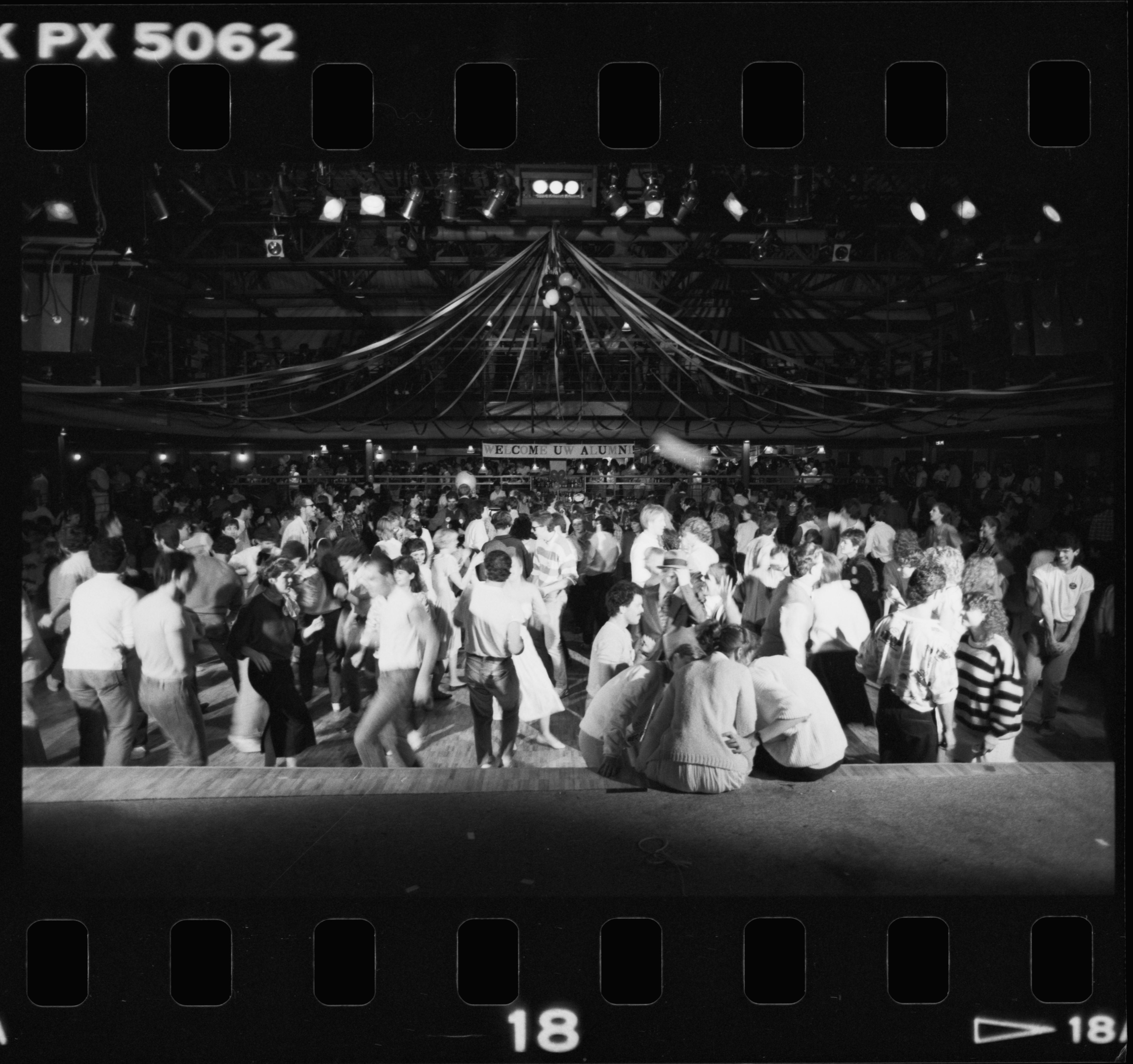 Fed Hall as a dance hall is packed with dancers and streams drapped from the roof
