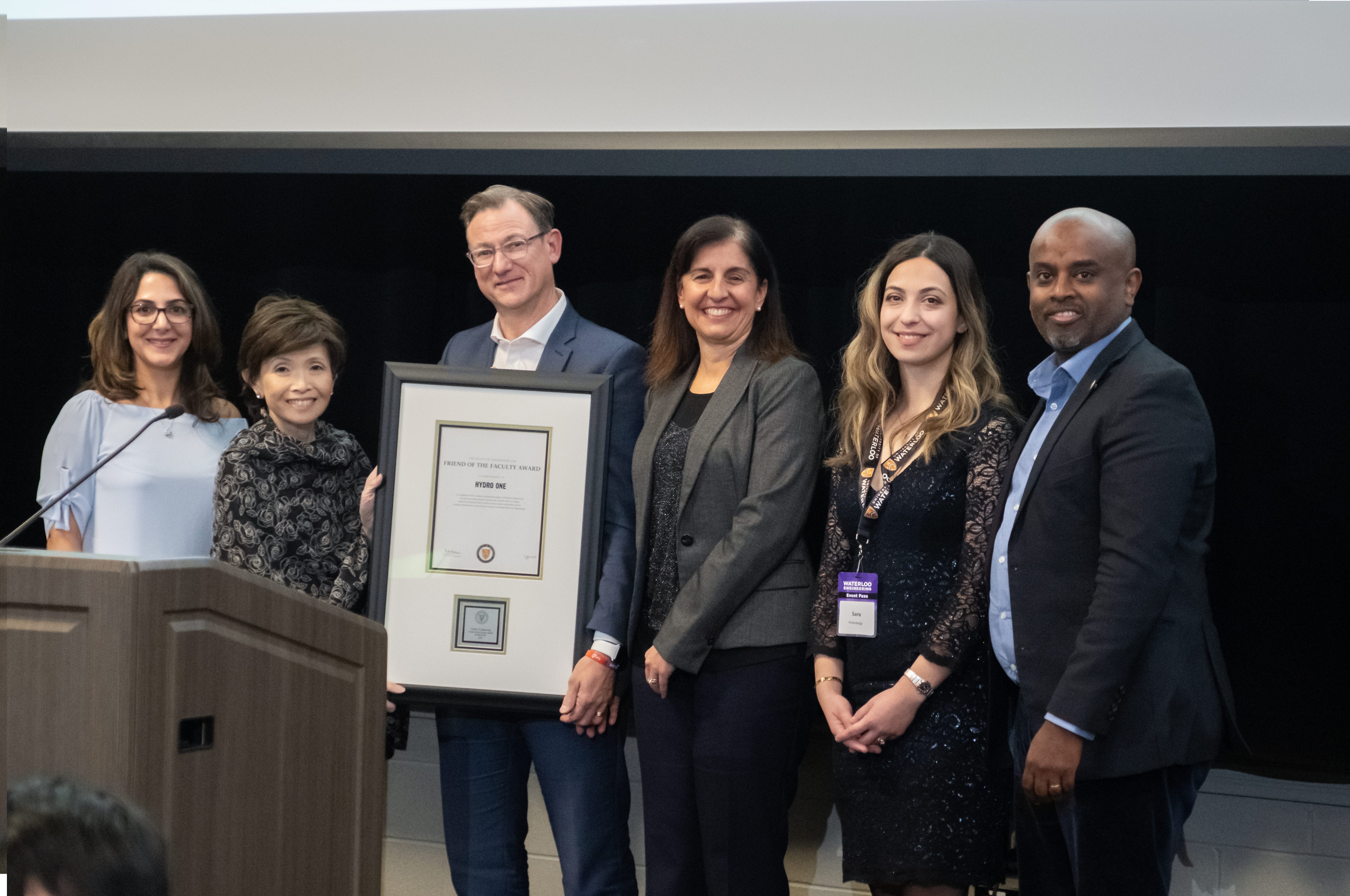 Hydro One representatives (left to right) Greg Lane, Sara Aslanbeigi, Temesghen Bzauayehu, Bahareh Tehrani and Vivian Yoanidis pose together at the 2019 Awards Dinner.