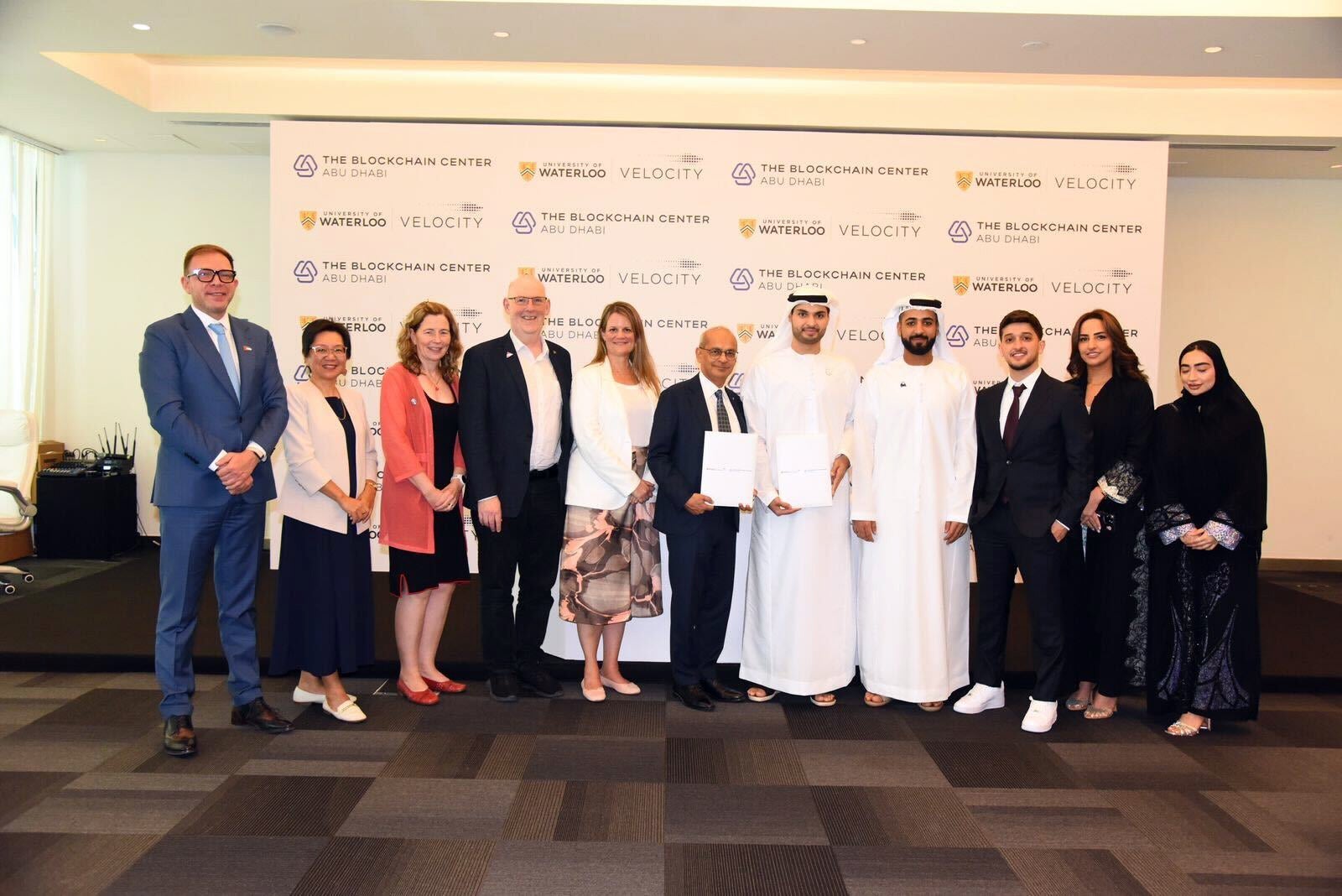 Respresentatives from UWaterloo and The Blockchain Center in Abu Dhabi line up and pose for a photo