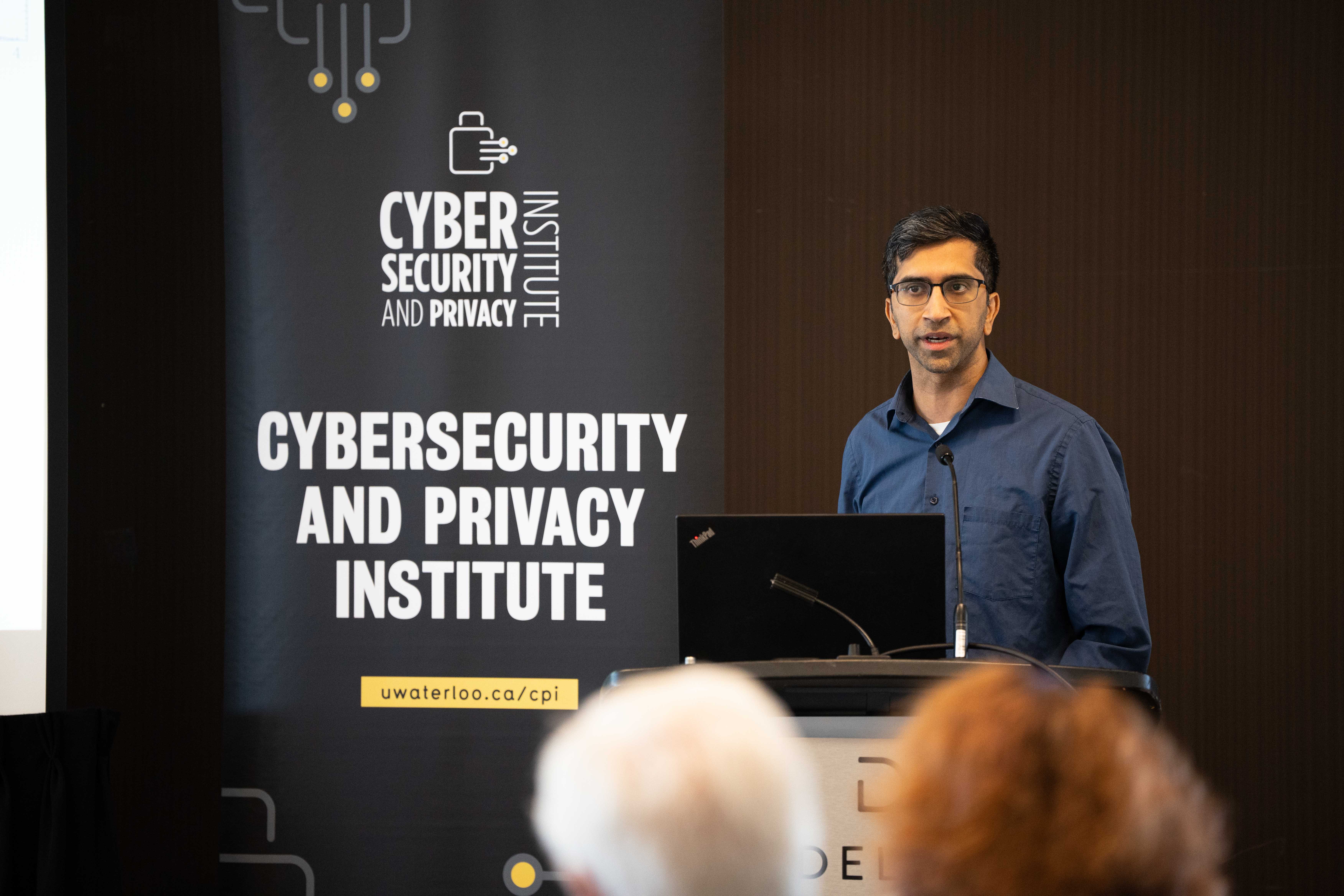 Gautnam Kamath at a podium