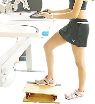 Participant in recent study uses footrest at a standing desk.