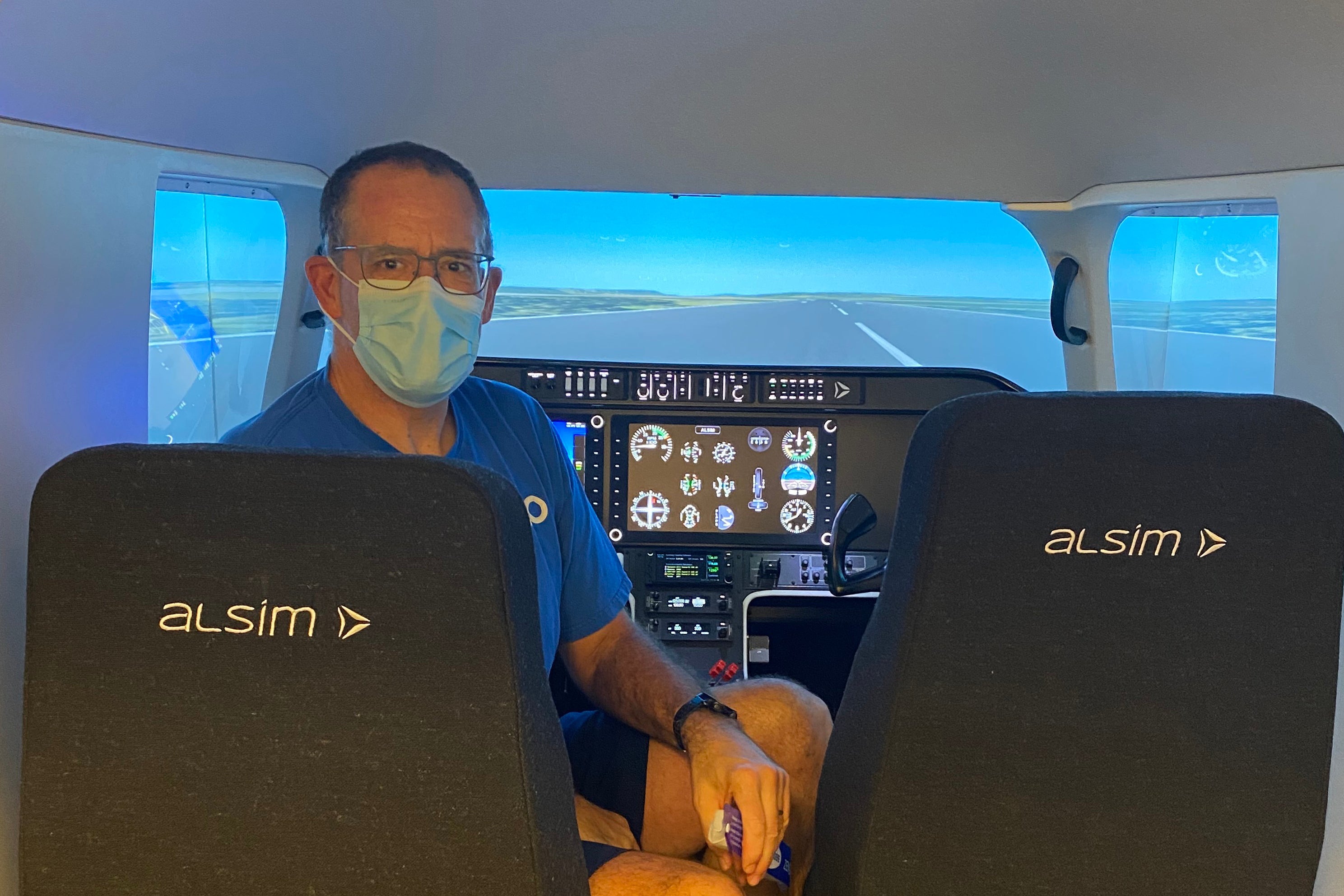 Dean of Science Bob Lemieux in the flight simulator