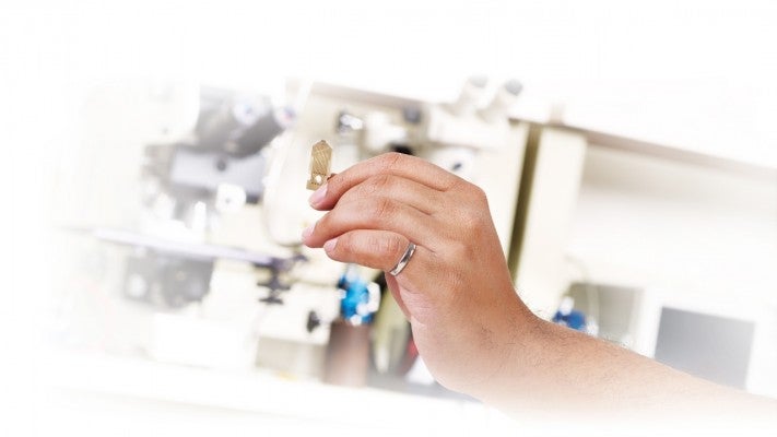 Hand holding microscope
