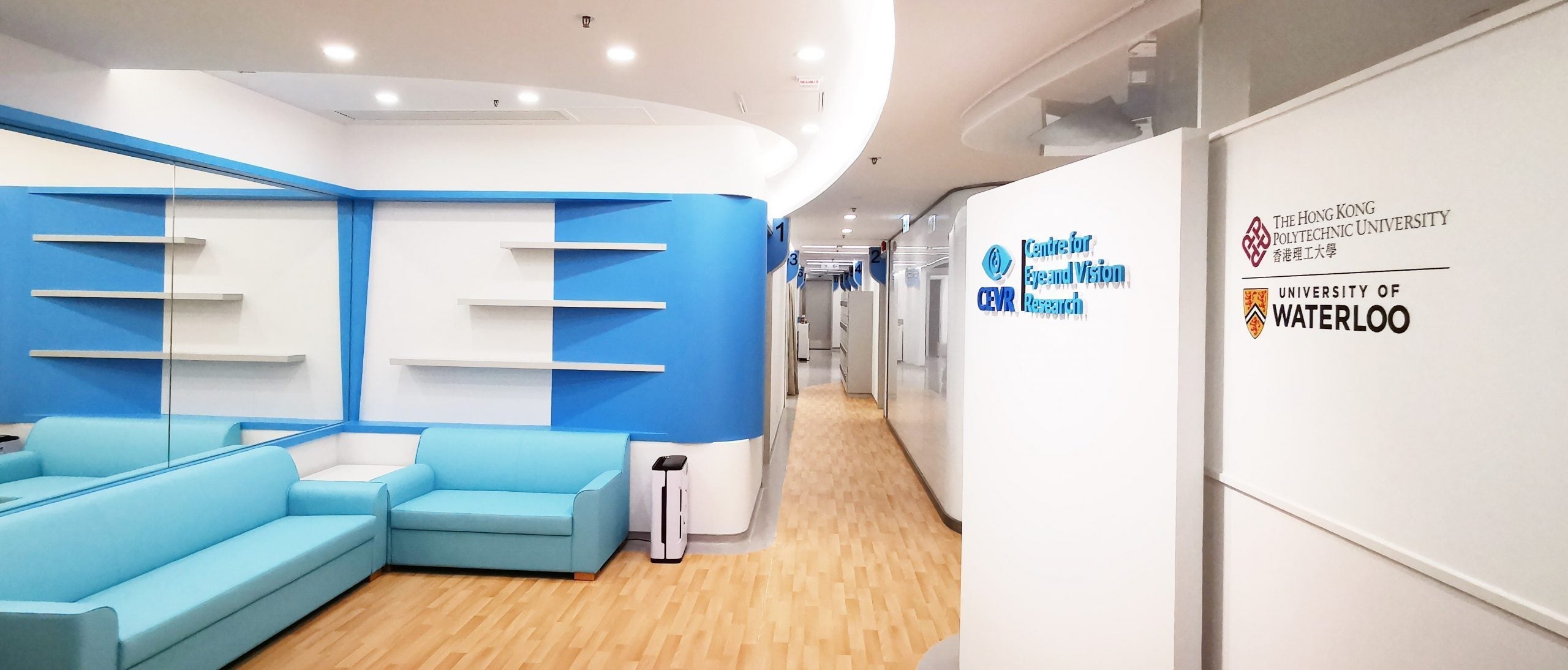 The CEVR clinical laboratory with blue couches and shelving on the walls
