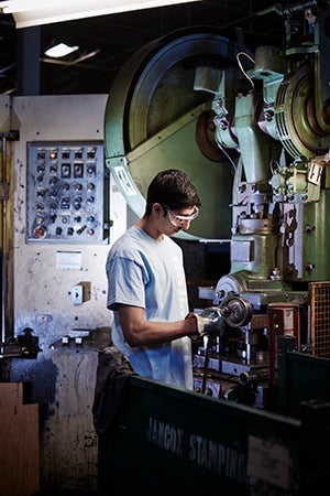 Student working with machinery