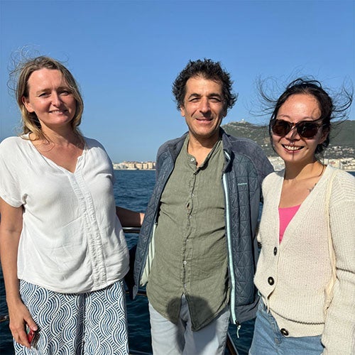 Jasmine and two of her colleagues by the seaside