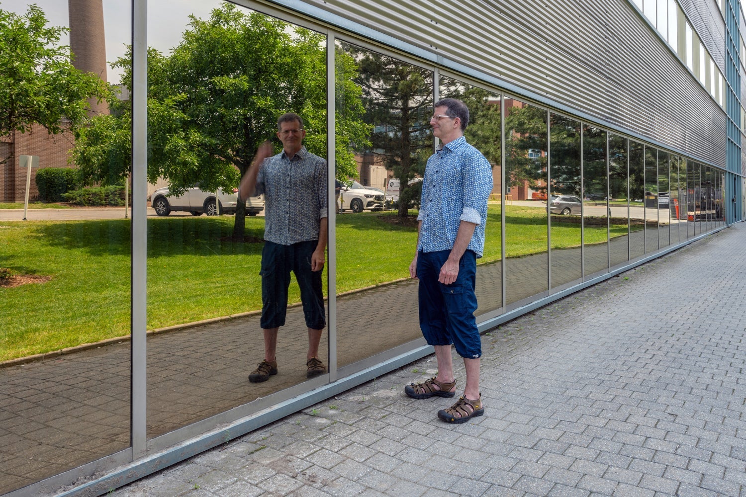 Dr. Craig Kaplan and his reflection in a window.