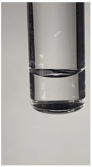 A suspended droplet atop a generated interfacial layer of nanoparticle (CNC)-surfactant. The top phase is hexane-POSS, and the bottom phase is CNC suspension. (University of Waterloo)