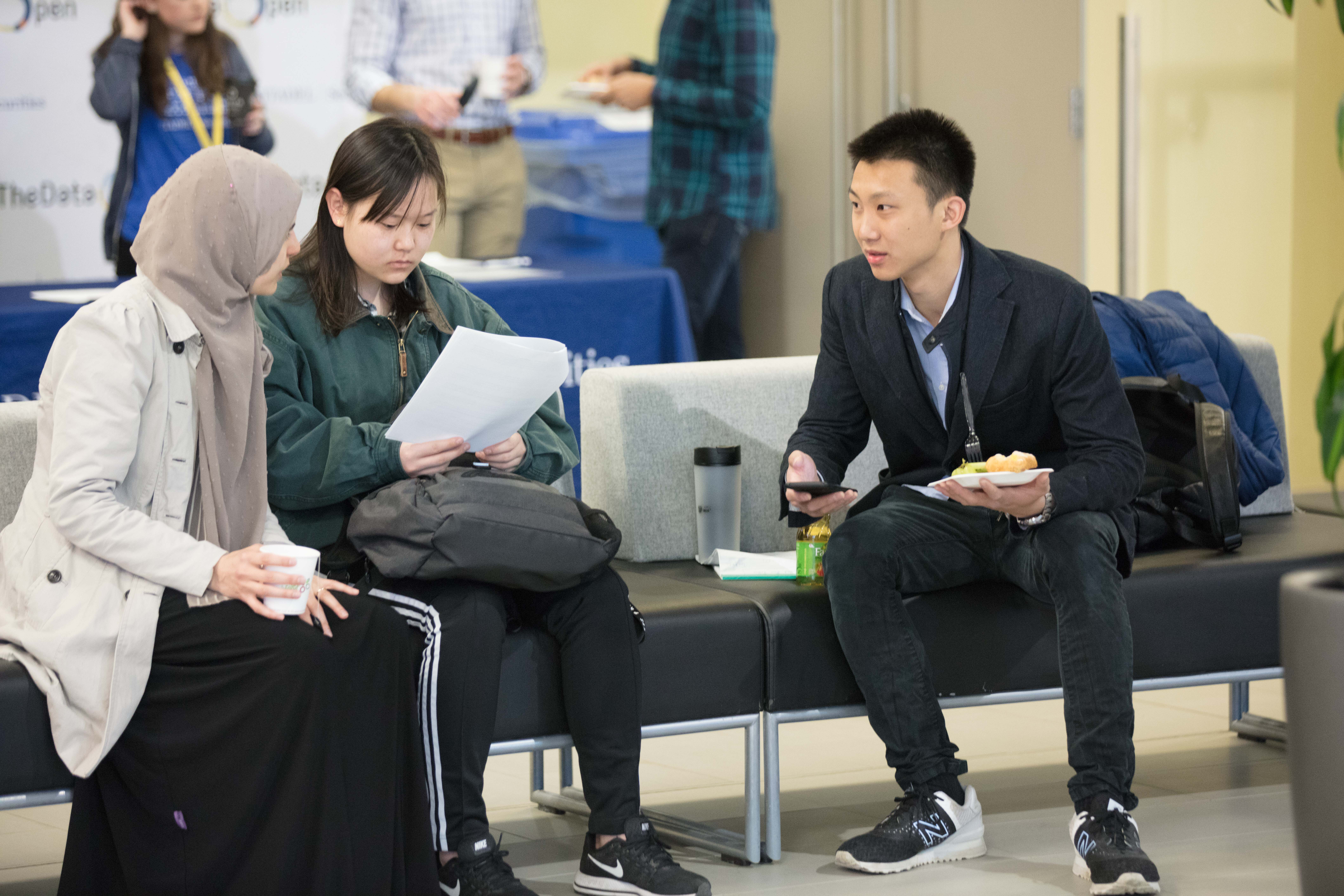 Two students discuss the competition with each other