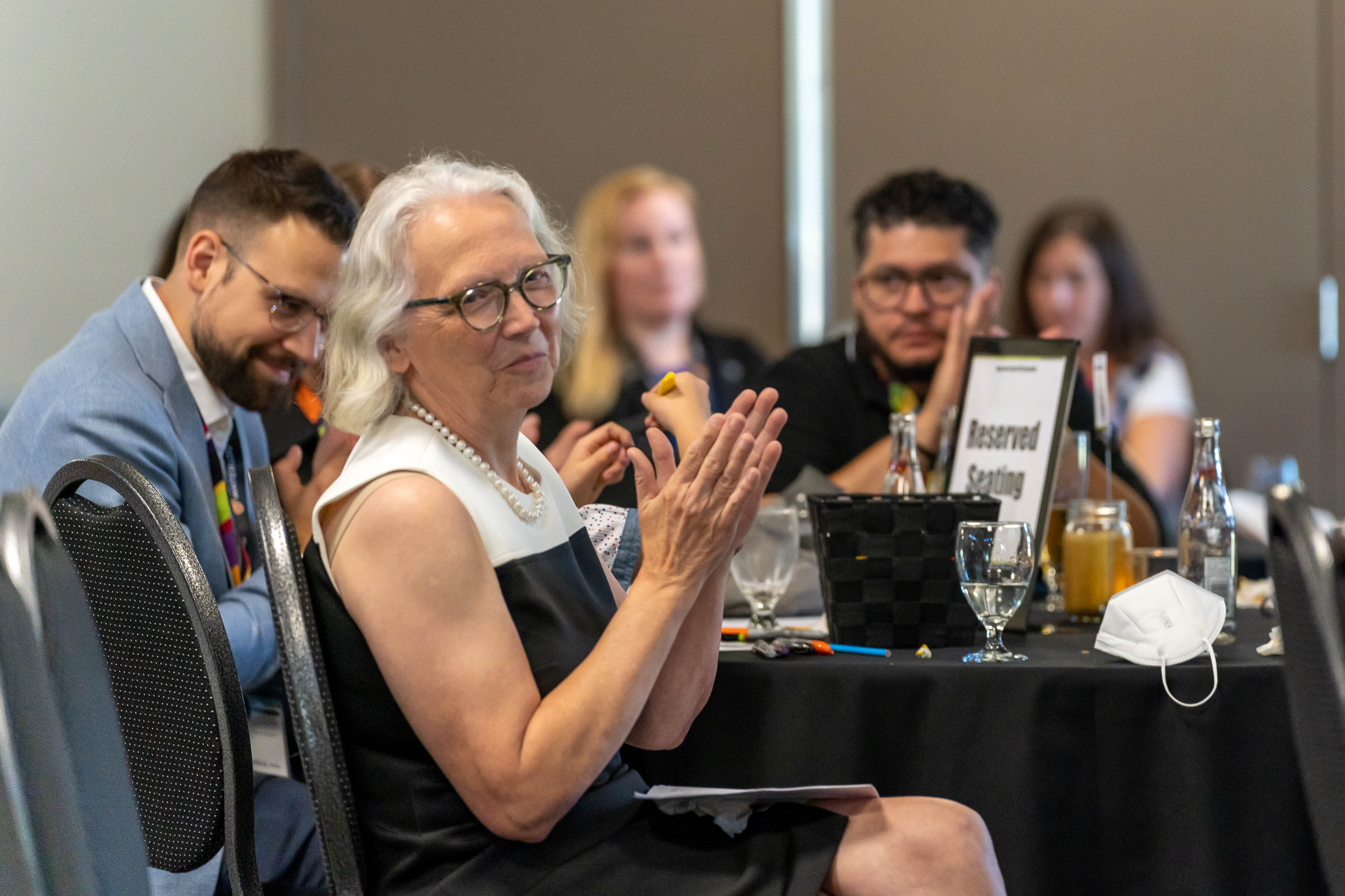 Professor Jean Andrey clapping at her retirement farewell event