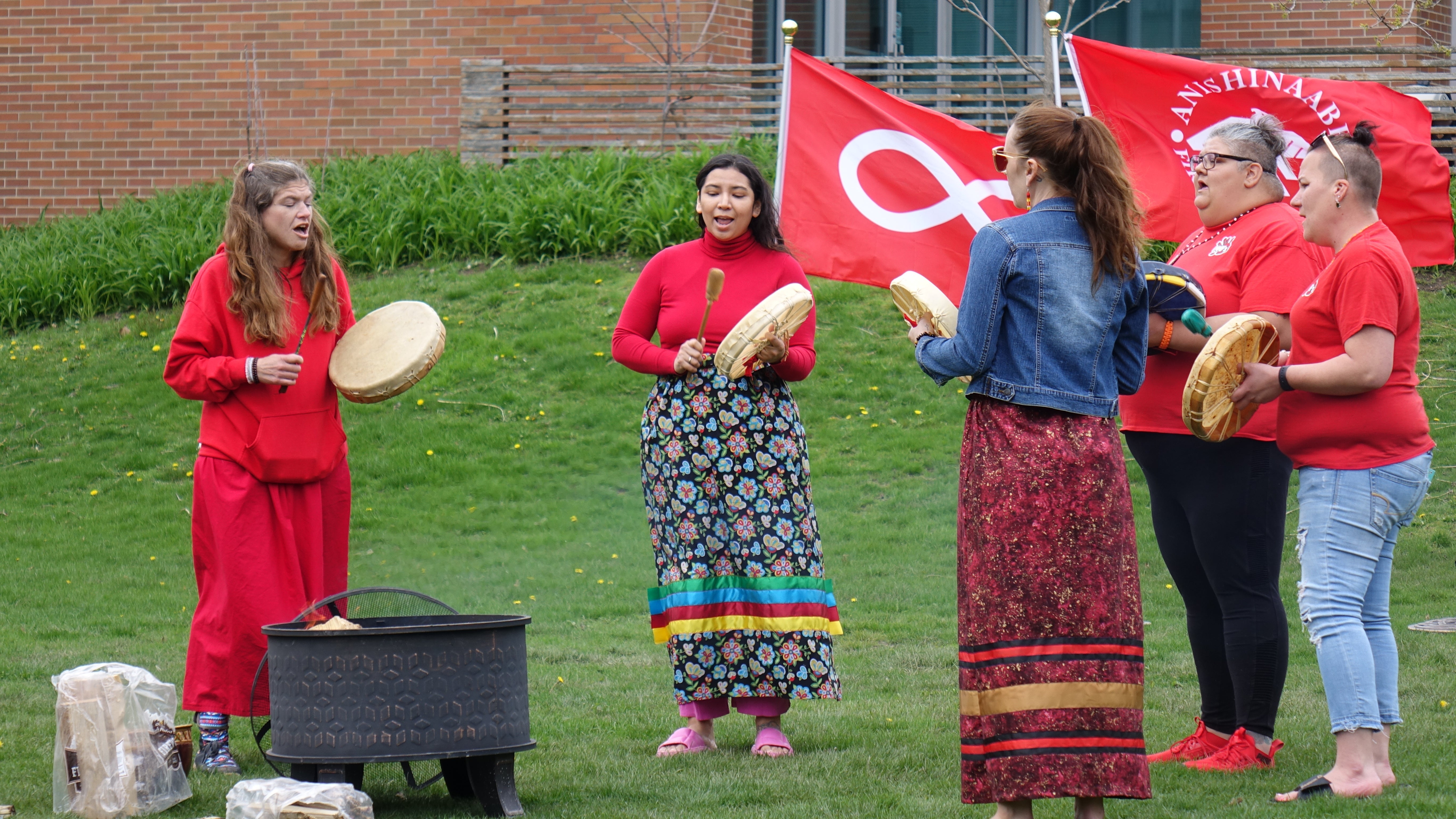 Indigenous women performing a song
