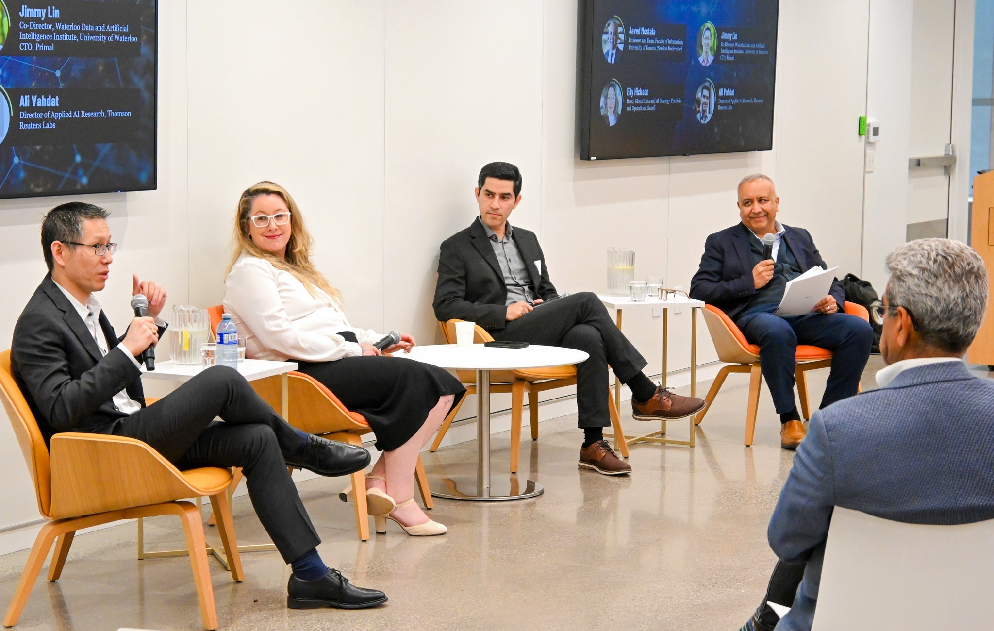 Dr. Jimmy Lin speaking during a panel discussion, with Eily Hickson, Dr. Ali Vahdat and Javed Mostafa