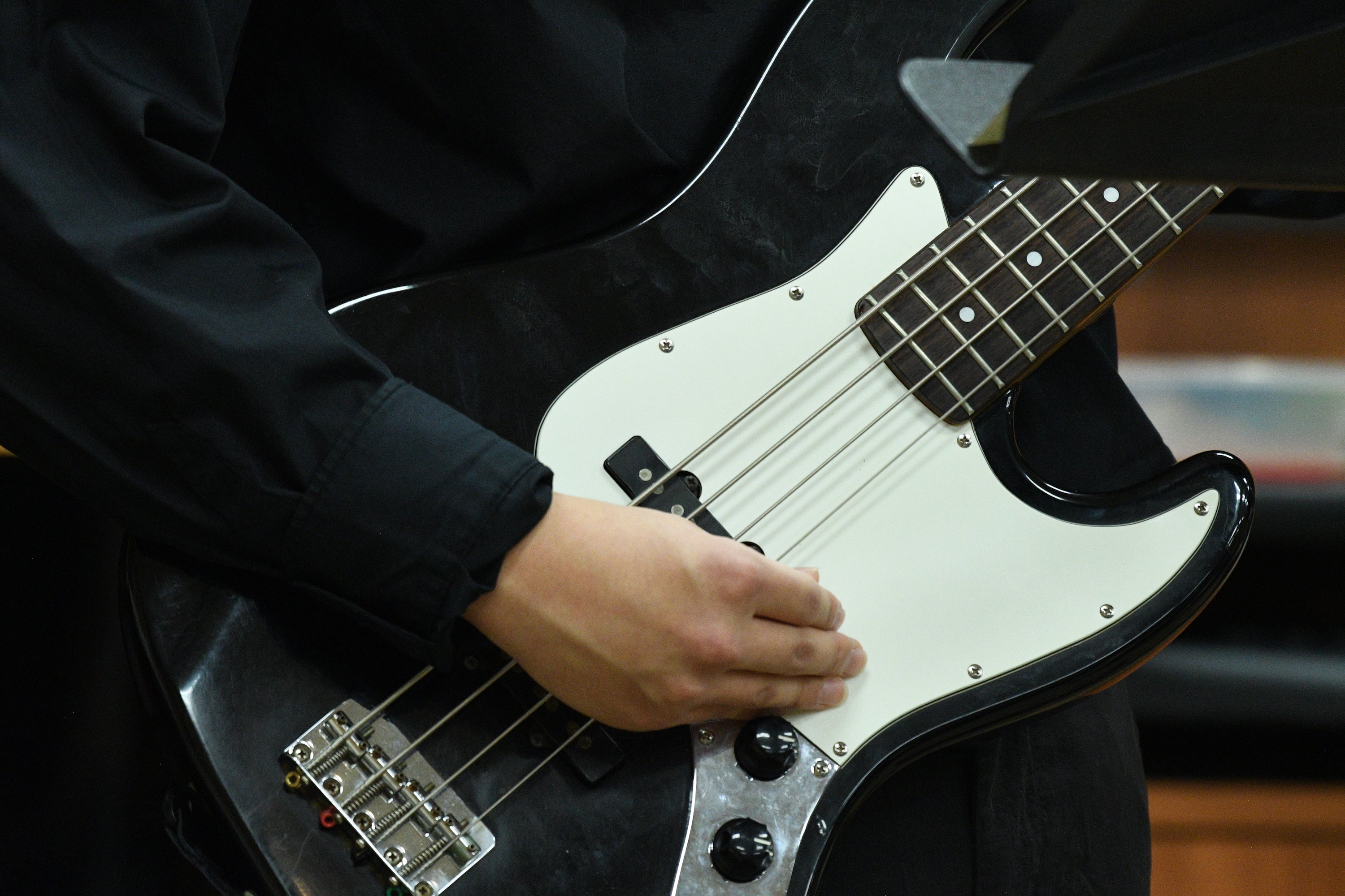 A student plays bass guitar