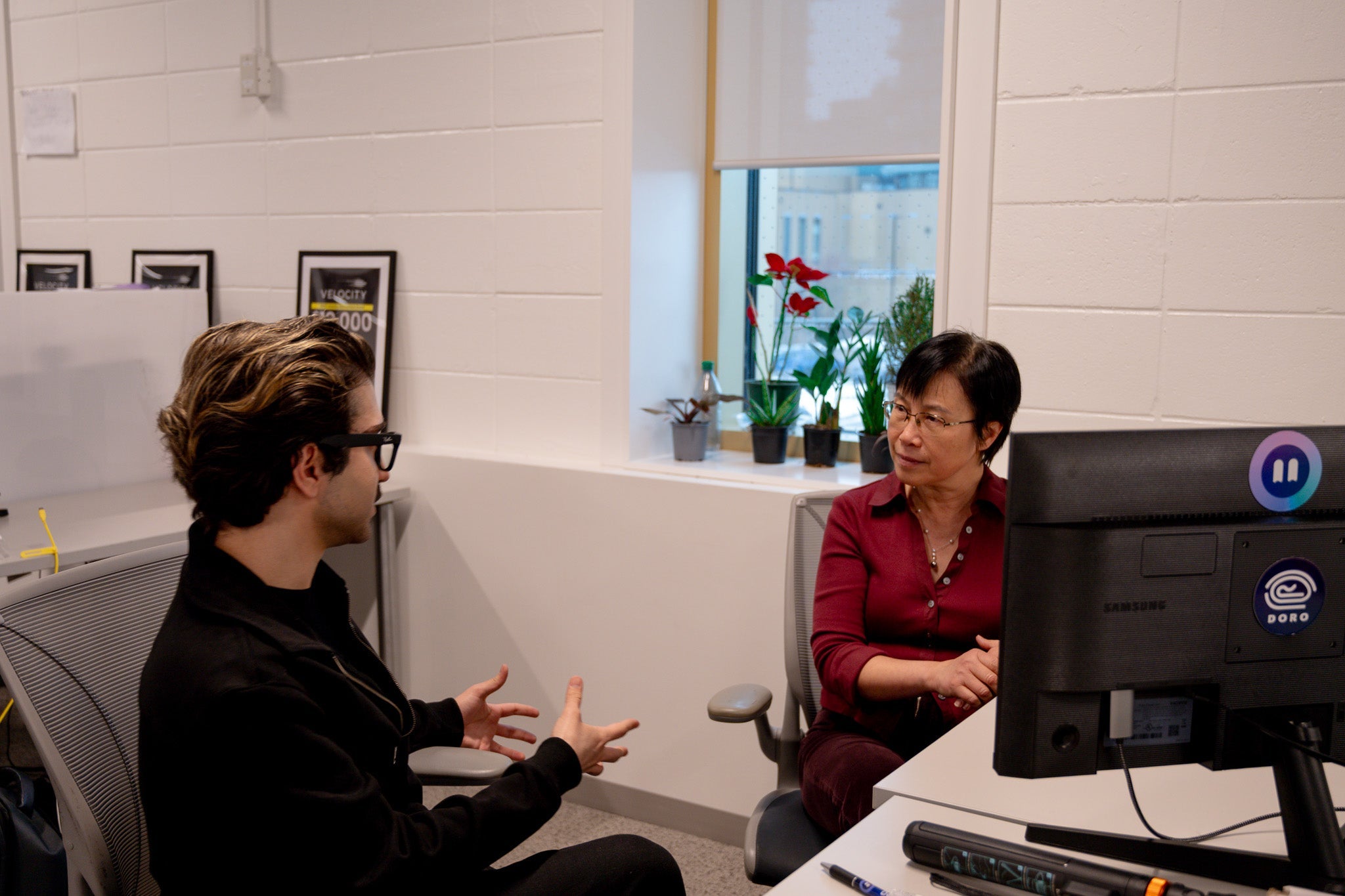 Rastin Rassoli and Dr. Helen Chen working together inside Doro's space inside the Innovation Arena