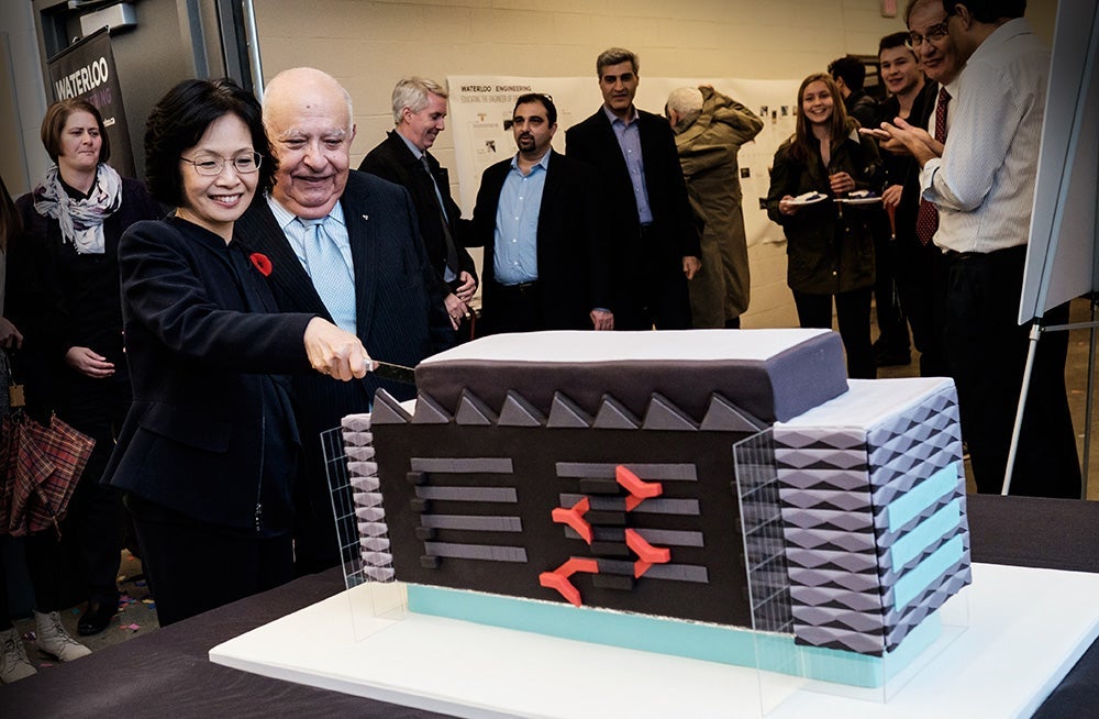 Pearl Sullivan and Al Sedra cutting the cake